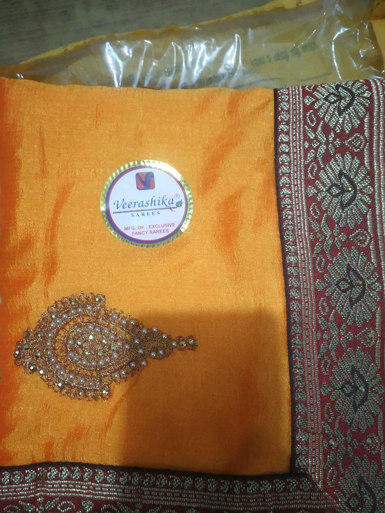 Elegant Orange Silk Saree with Embellishments