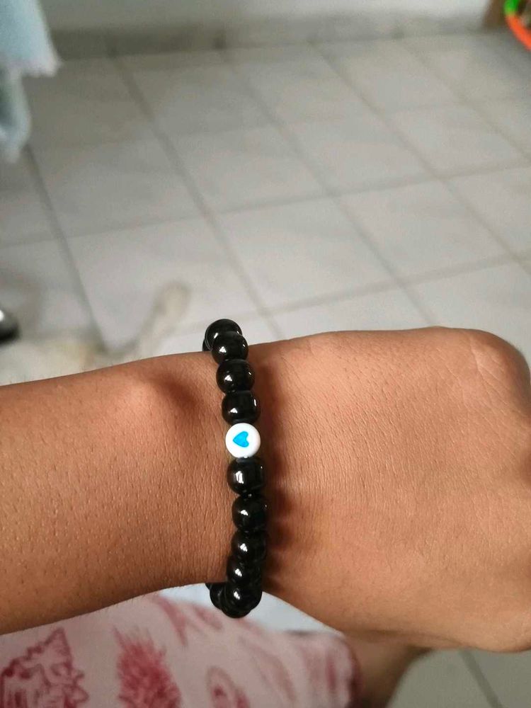 Black Beaded Bracelet with Blue Heart Charm