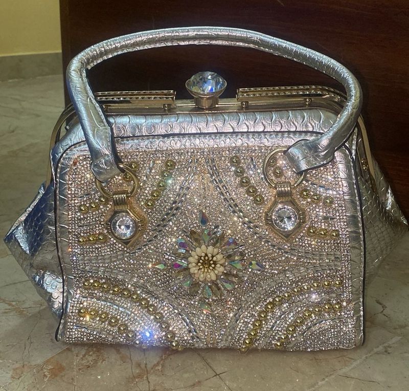 silver solid hand bag