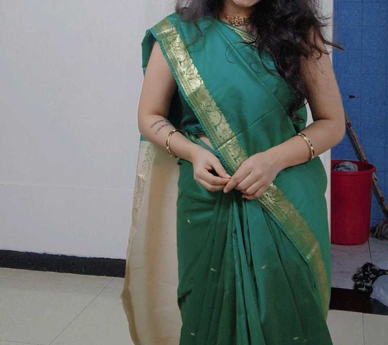 Elegant Teal Green Saree with Gold Border