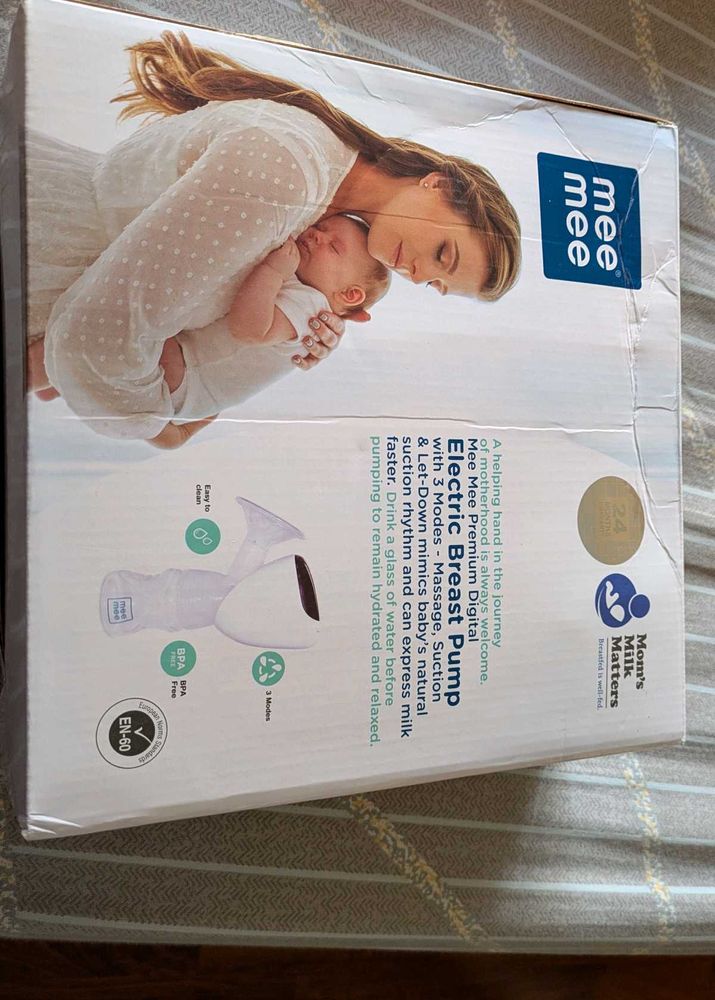 Electric Breast Pump With Feeding Bottle.