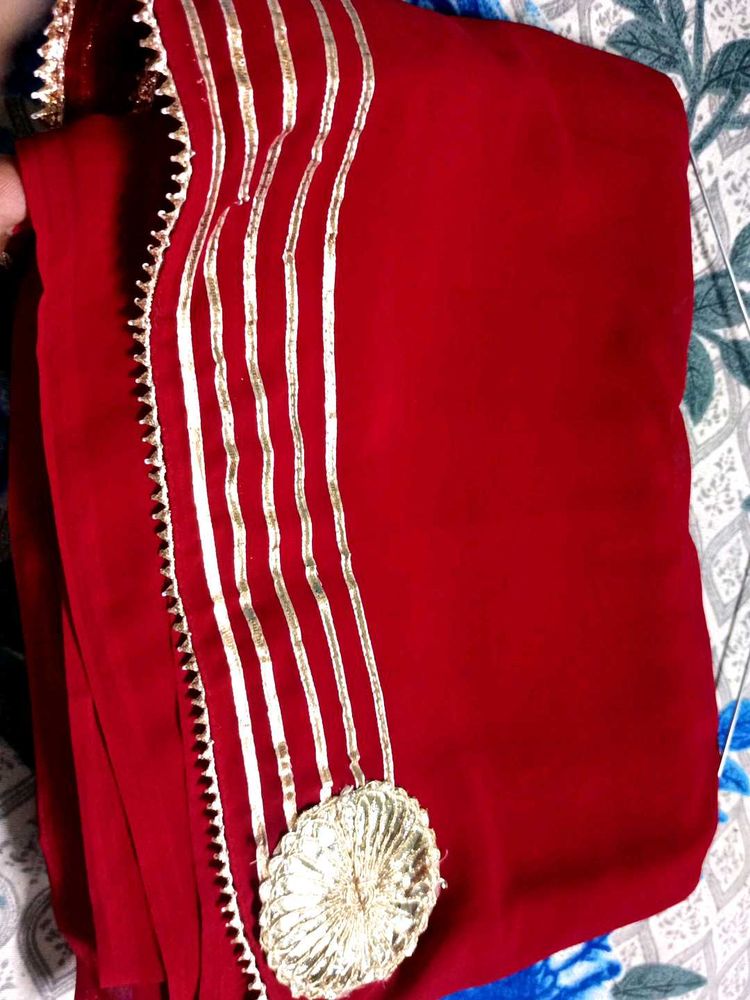 Elegant Red Saree with Gold Embellishments