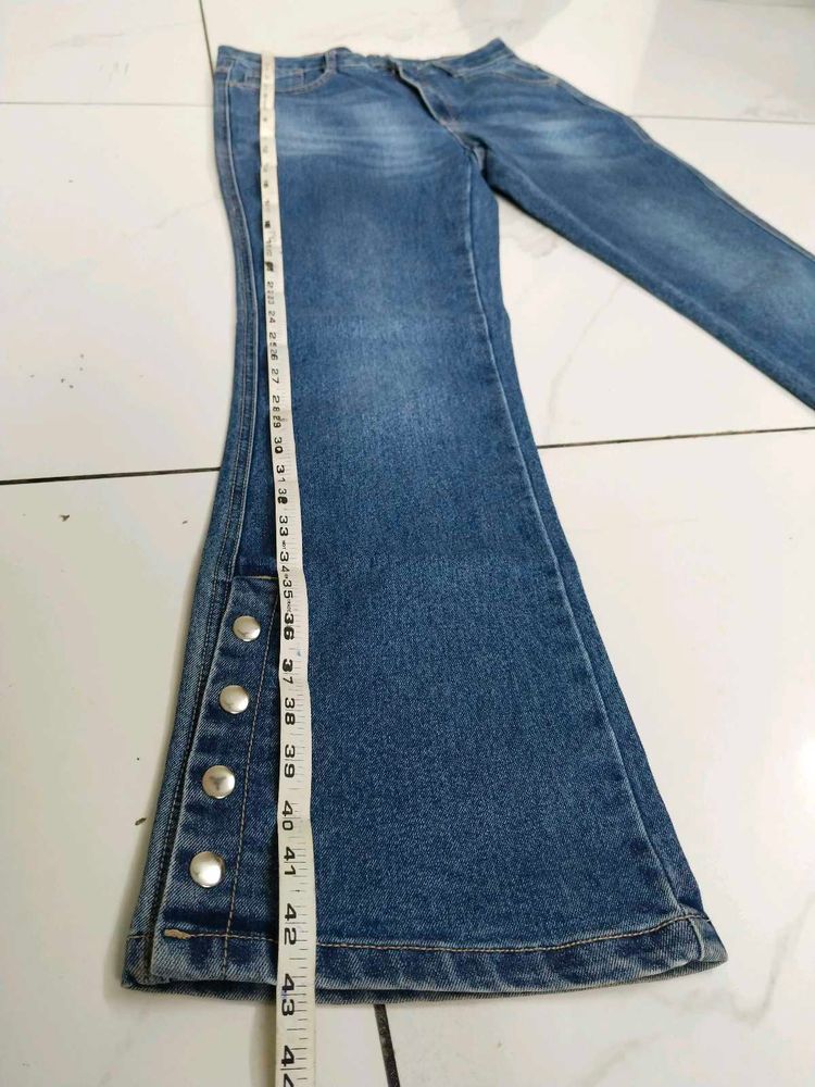 Flared Blue Jeans with Button Detail