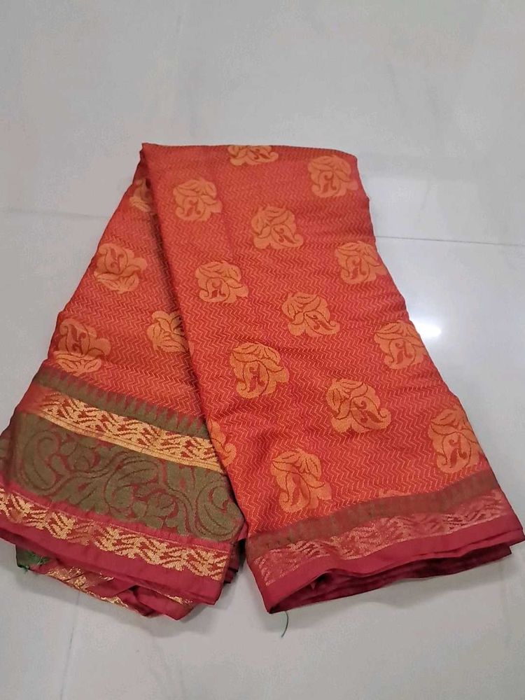 Elegant Orange Saree with Floral Motifs