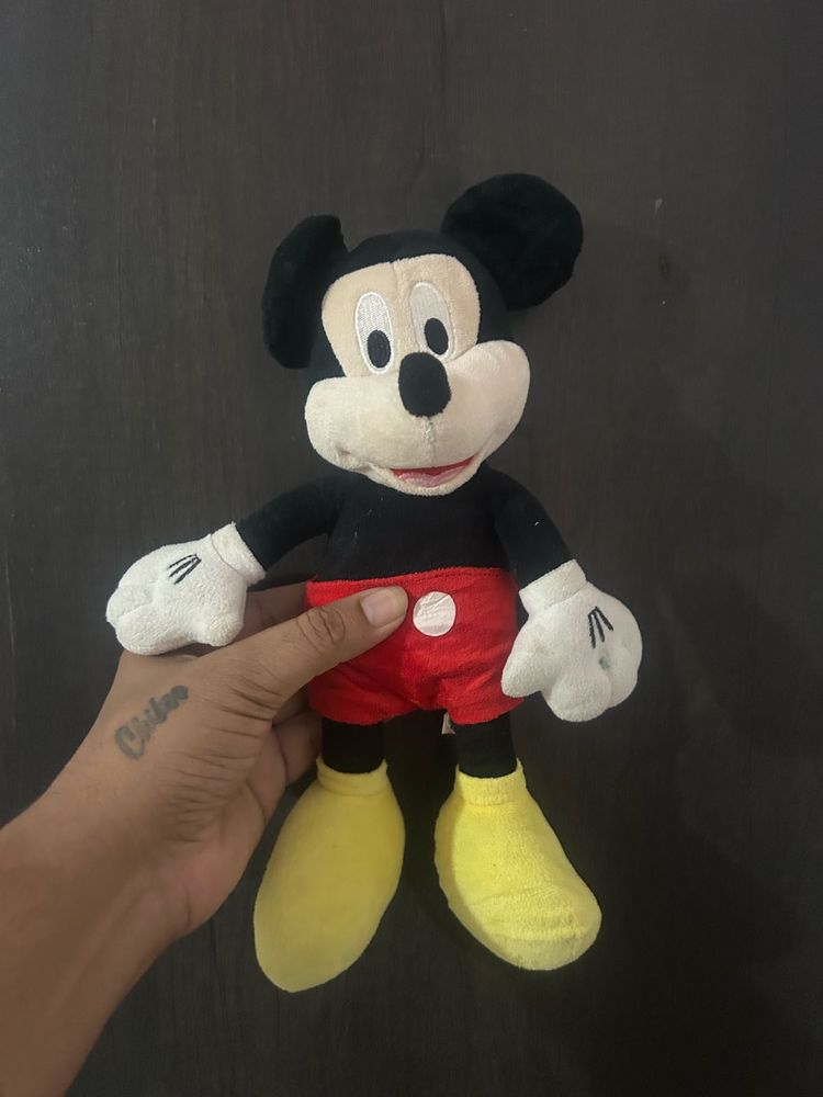 Mickey Mouse plush toy, resembling the classic