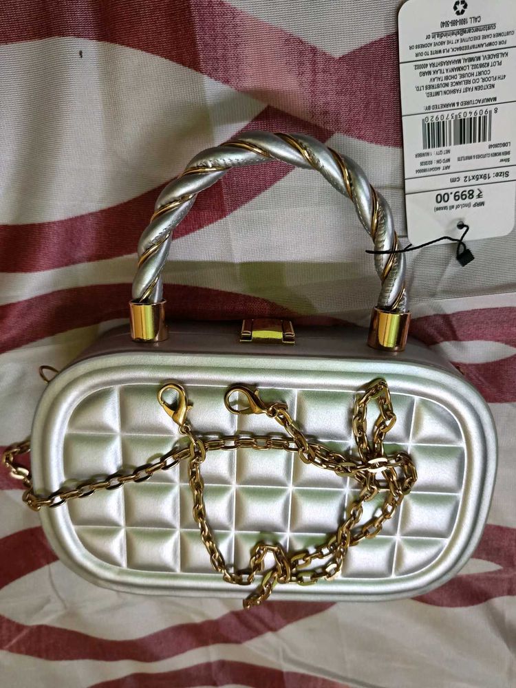 Elegant Silver Clutch with Gold Chain