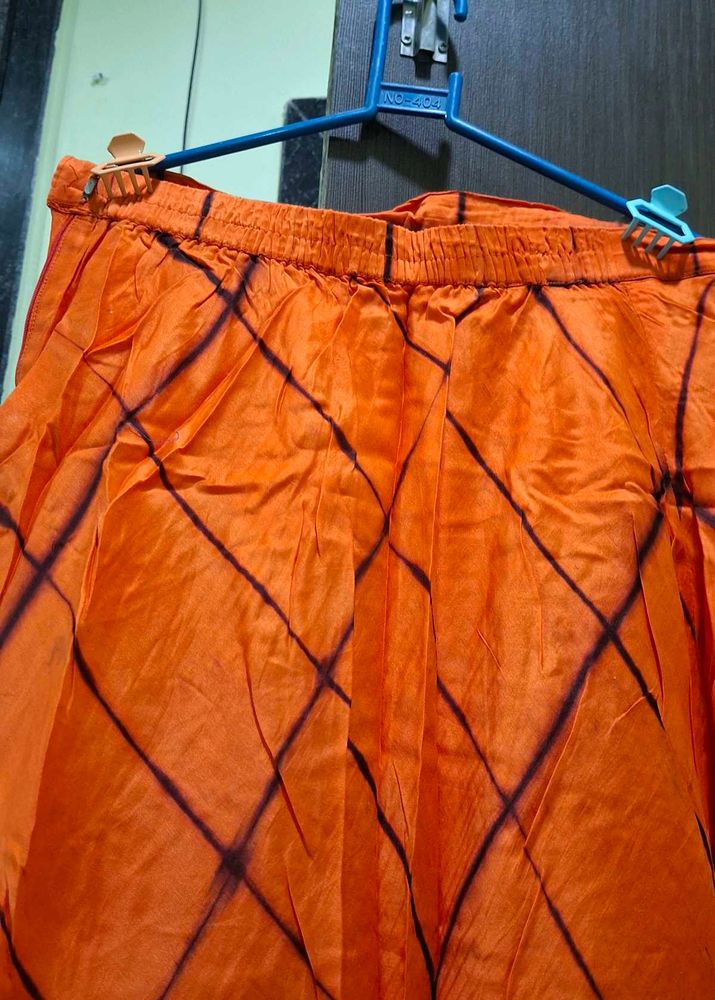 Vibrant Orange Ethnic Skirt with Tie-Dye Pattern