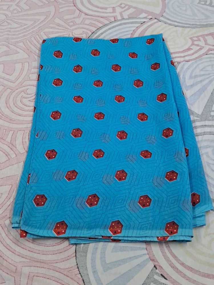Blue Saree With Red And Some White Dots.