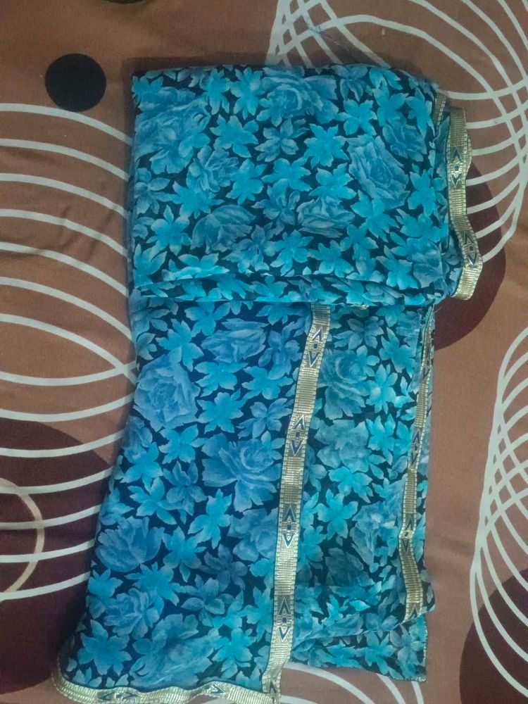 Blue Floral Print Saree with Gold Border