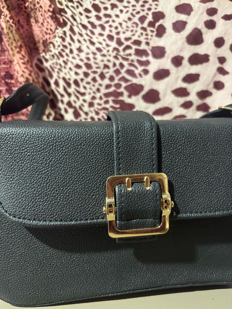 Chic Black Crossbody Bag with Gold Buckle
