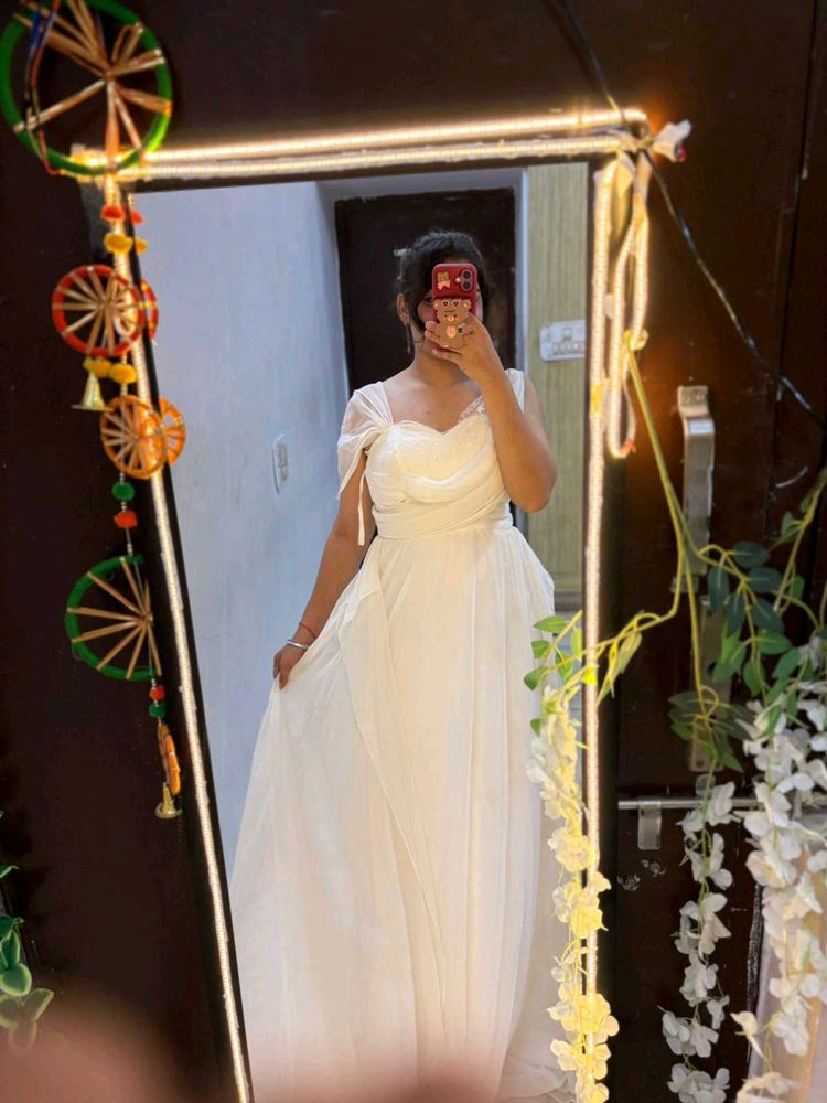 white full length gown with too much detailing