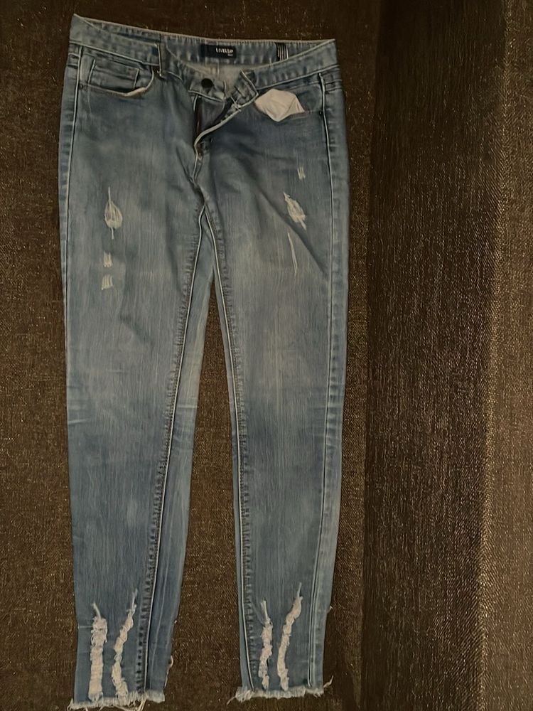 Distressed Blue Denim Jeans