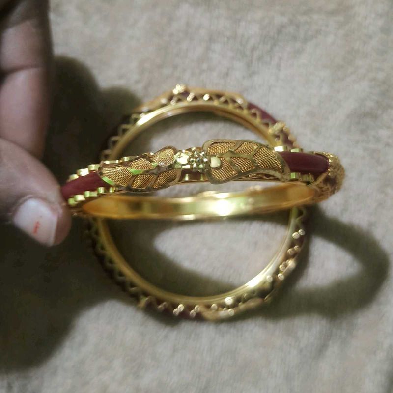Elegant Gold Bangles with Red Accents