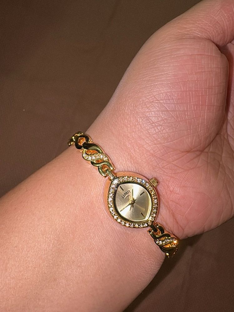 Elegant Gold Tone Watch with Rhinestones