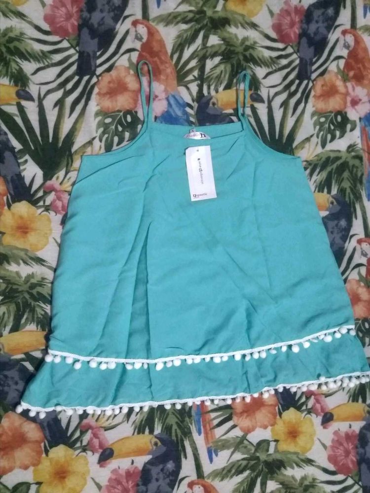Chic Teal Top with Pom Po