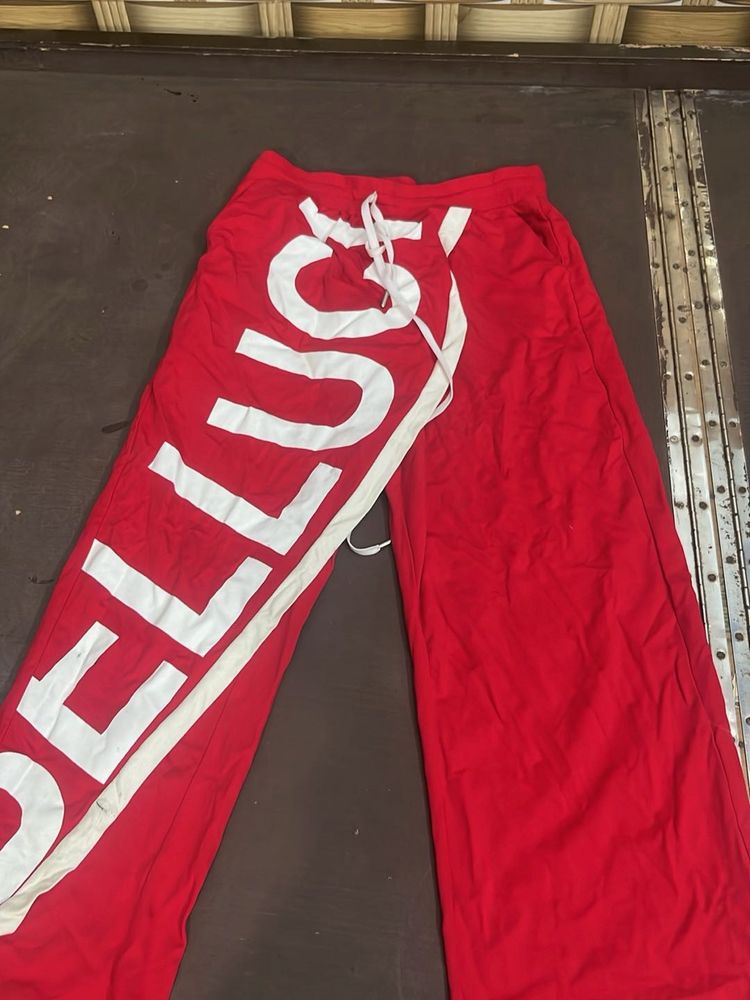 Red Wide-Leg Pants with Bold White Text