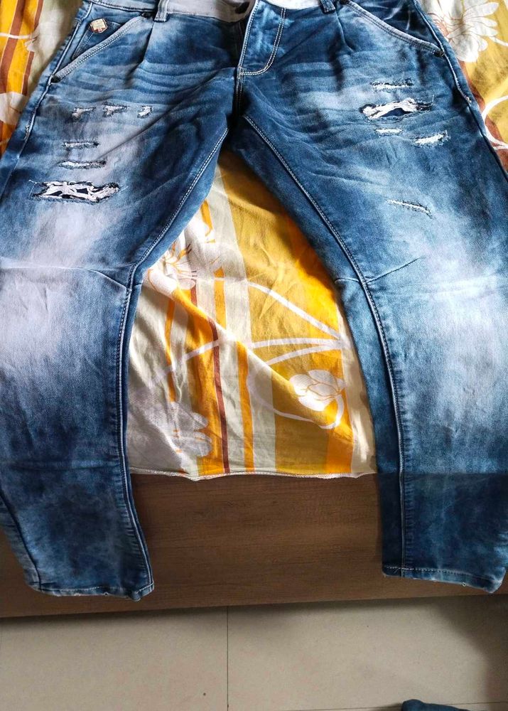 Distressed Blue Wash Denim Jeans