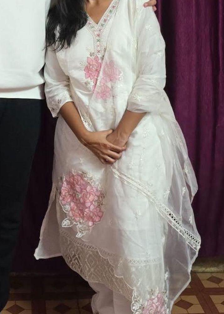 a beautiful white kurta set