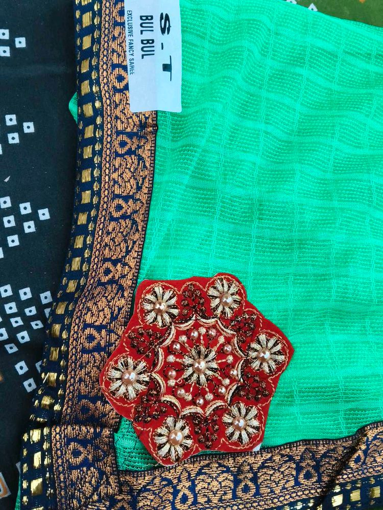 Elegant Green Saree with Intricate Border