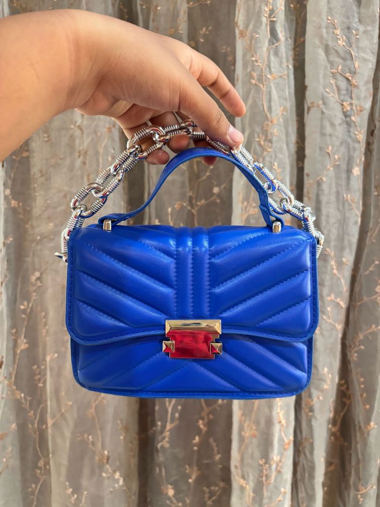 Blue sling purse
