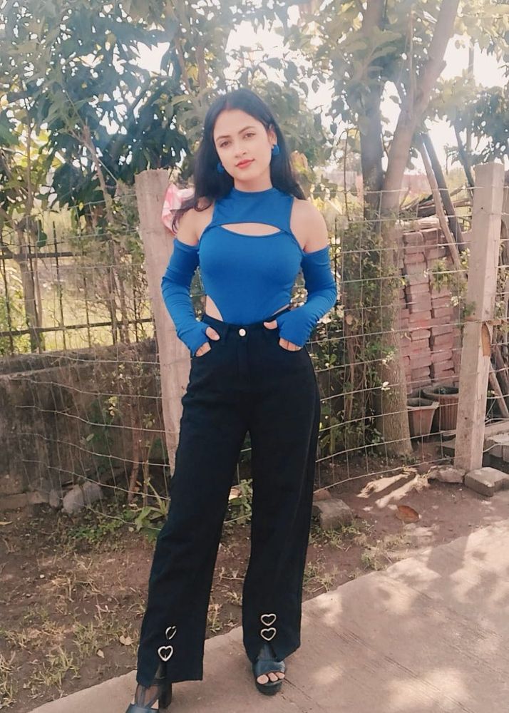 Stylish Blue Cut-out Top with Black Pants