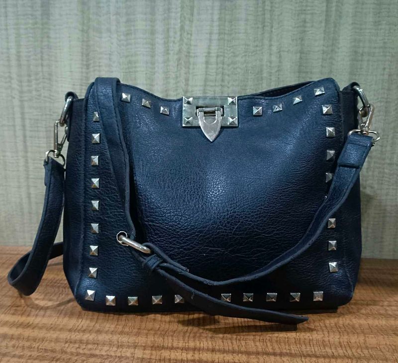 Black studded shoulder bag