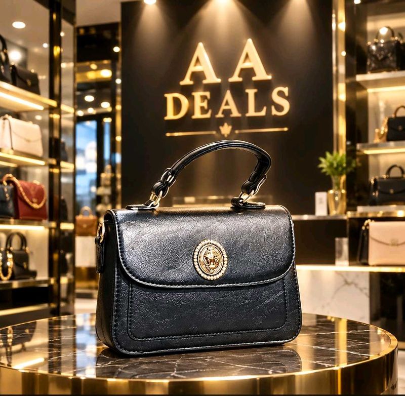 Chic Black Handbag with Gold Embellishment