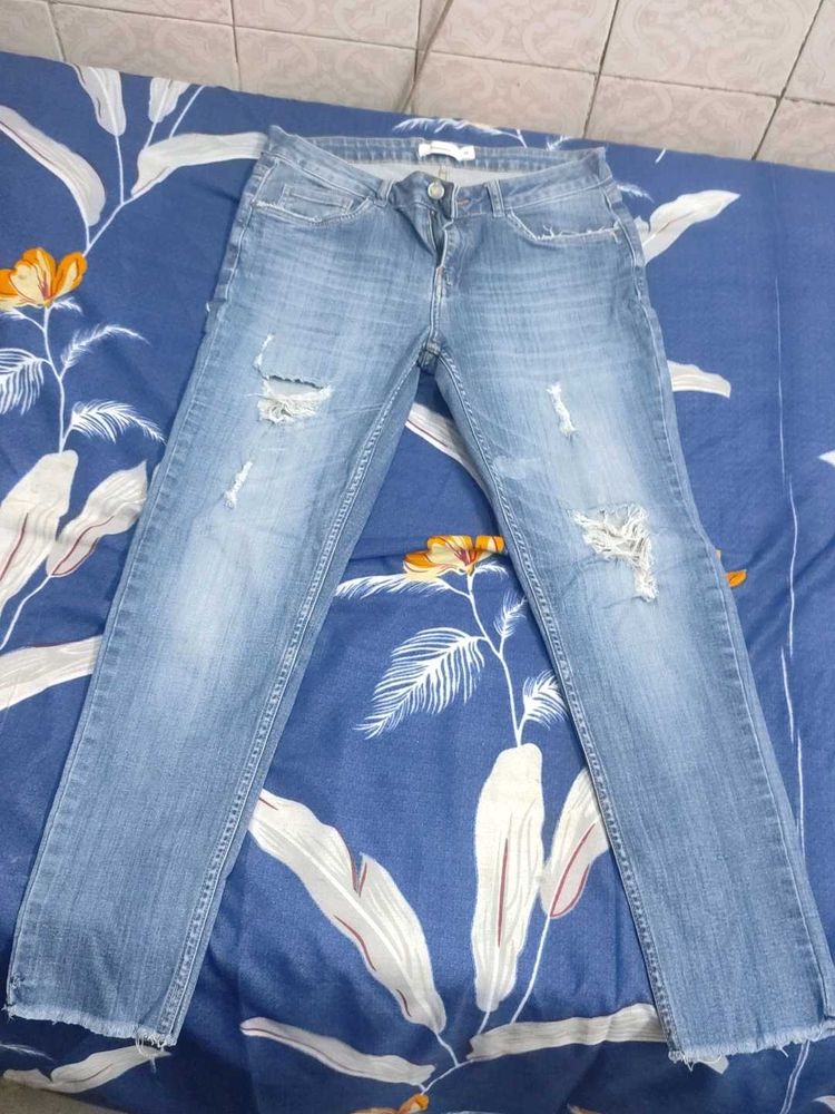 Distressed Light Wash Denim Jeans