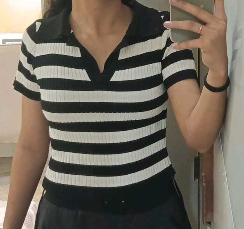 a black and white striped streetwear top. basic we