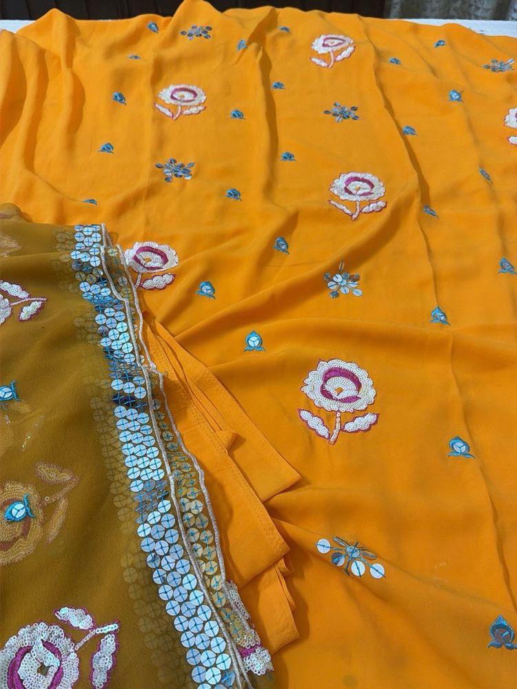 Vibrant orange unstitched suit  Embroidered Saree
