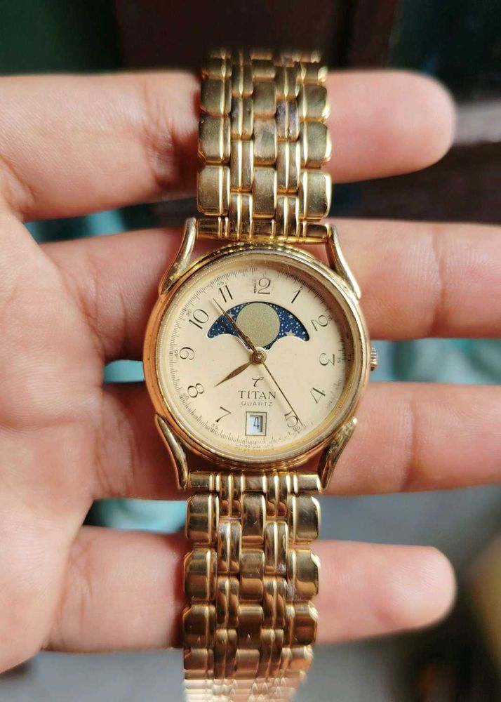 Elegant Gold Titan Watch with Moon Phase