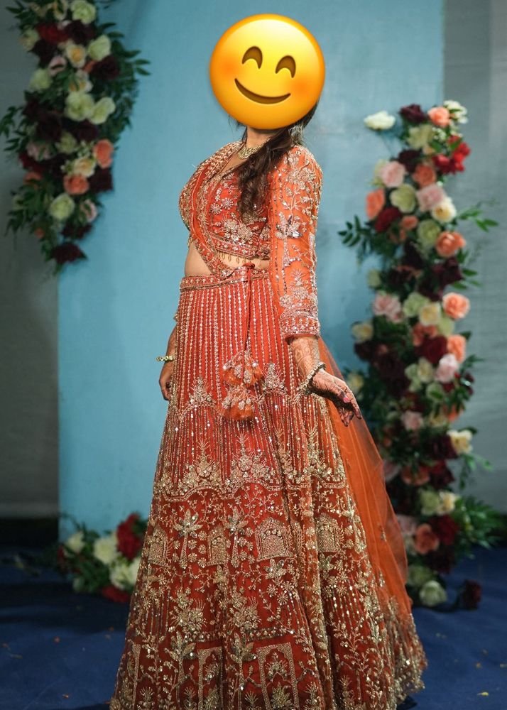 Stunning Orange Embellished Lehenga Choli