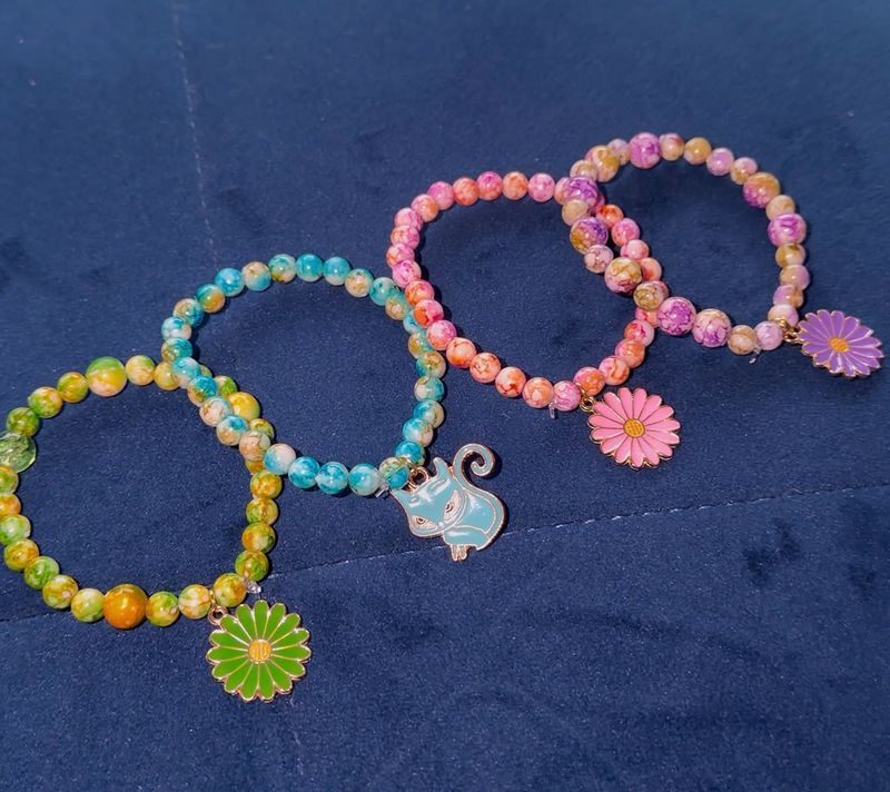 4 Beaded Bracelets with Charms