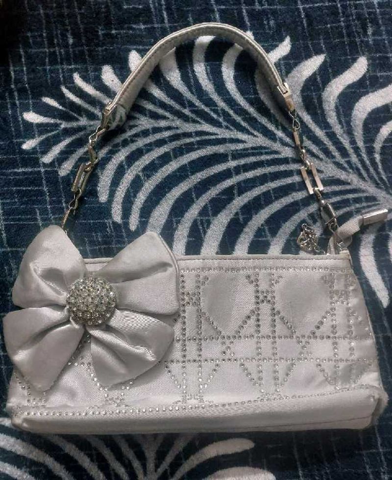 Elegant Silver Bow Clutch Bag