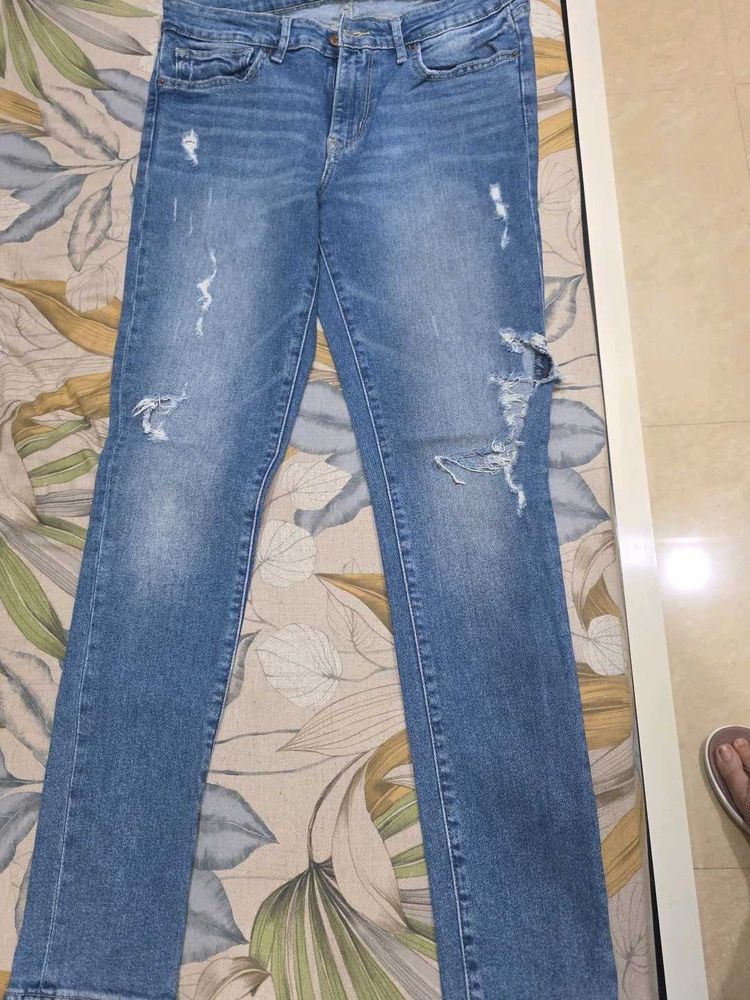 Distressed Blue Denim Jeans