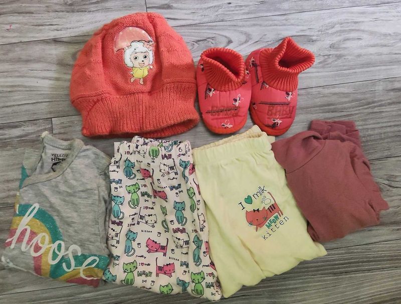 Bundle of baby clothes, beanie, shoes.