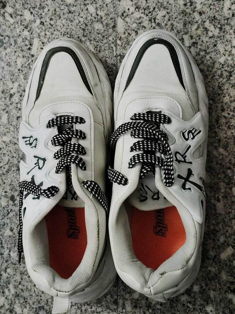 Stylish White Sneakers with Black Laces