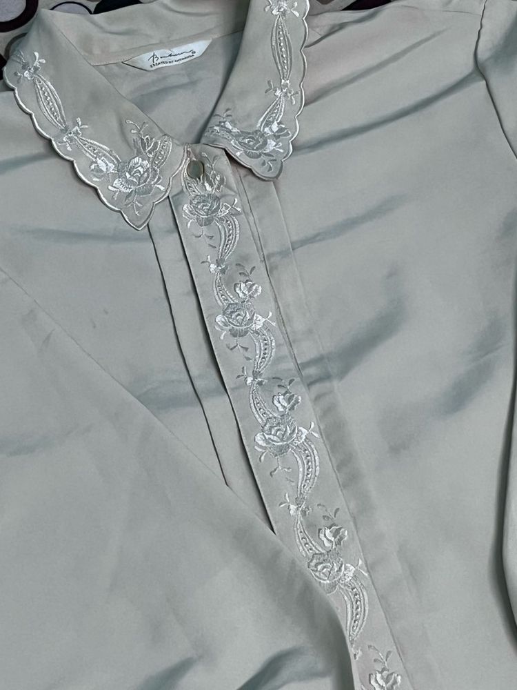 cream colored embroidery detail shirt