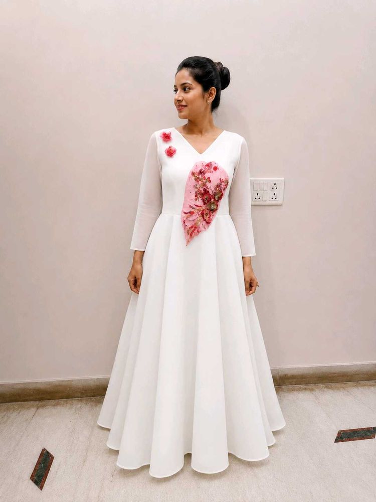 elegant white gown with floral emblishmnent