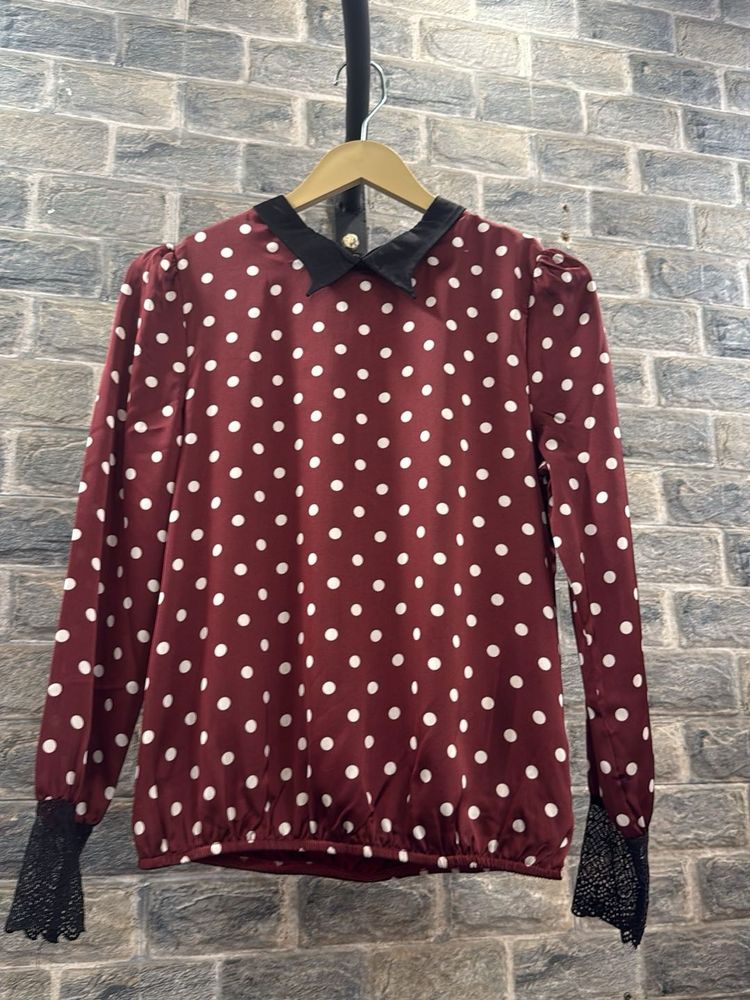 Chic Polka Dot Blouse with Lace Cuffs
