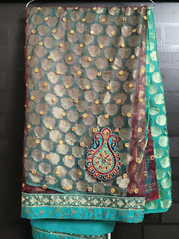 Elegant Teal Saree with Embellishments