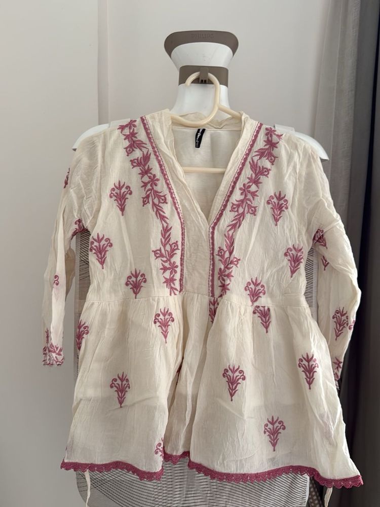 Embroidered Peplum Top