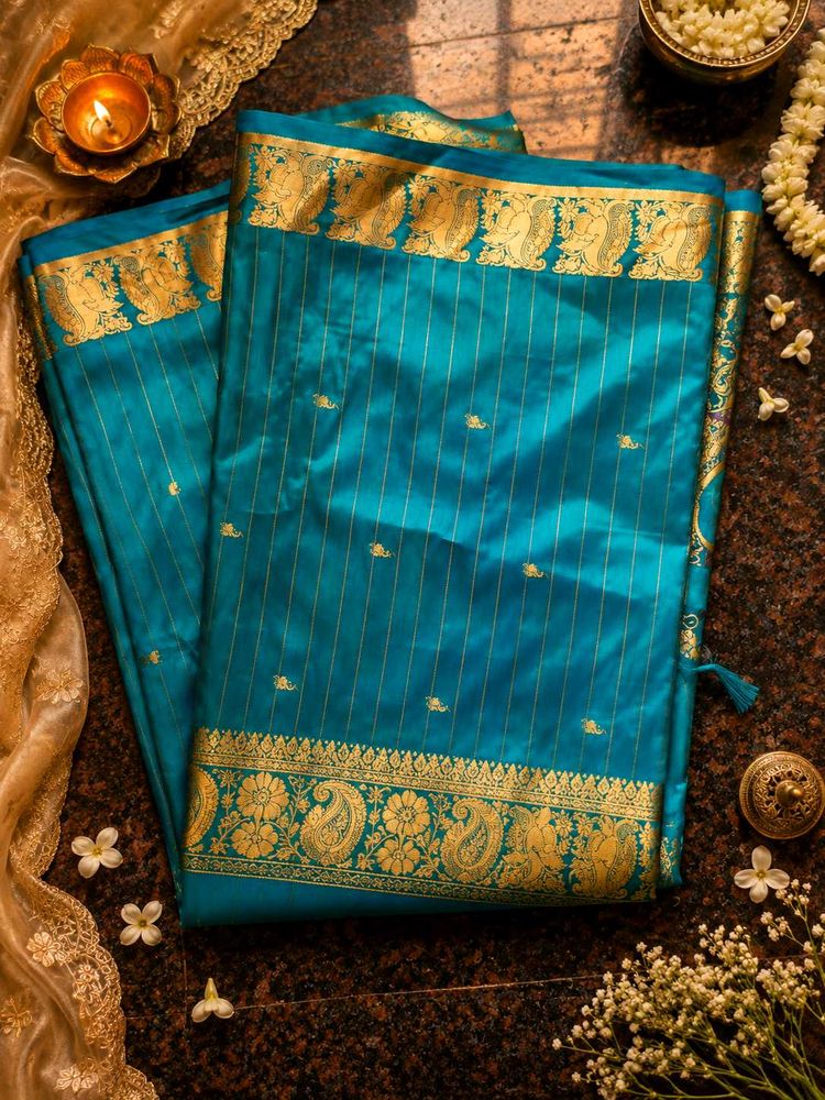 Stunning Teal Silk Saree with Gold Border