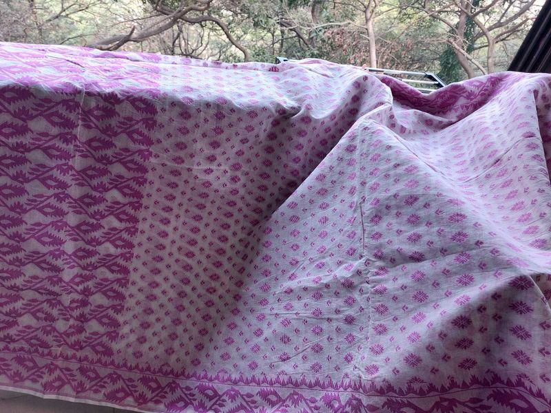 Magenta on white jamdani saree