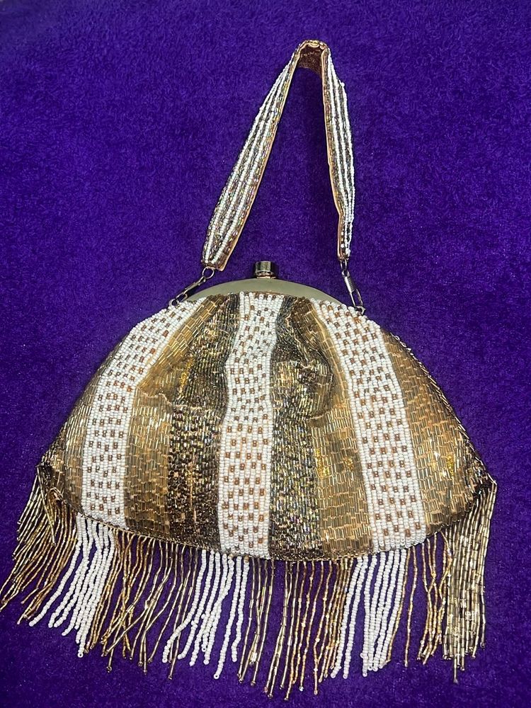 Anekaant Gold-Toned Embellished Tasselled Clutch