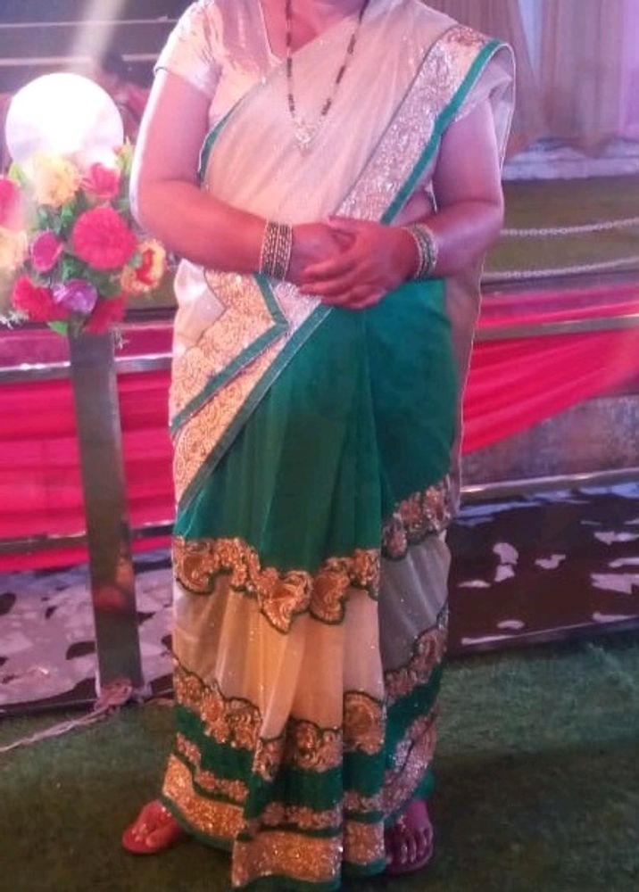 Beautiful Cream And Green Colour Net Saree Golden