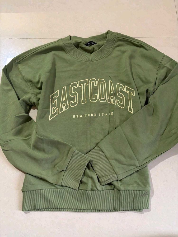 olive green sweatshirt