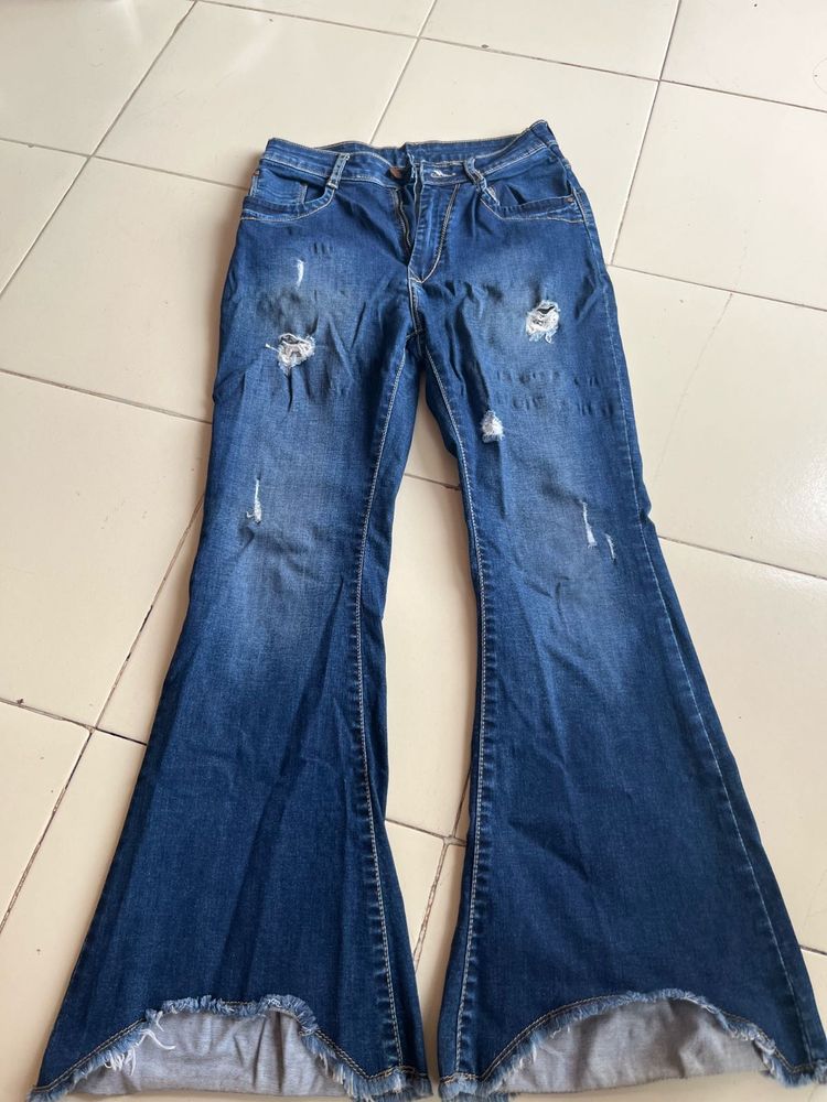 Distressed Blue Denim Jeans