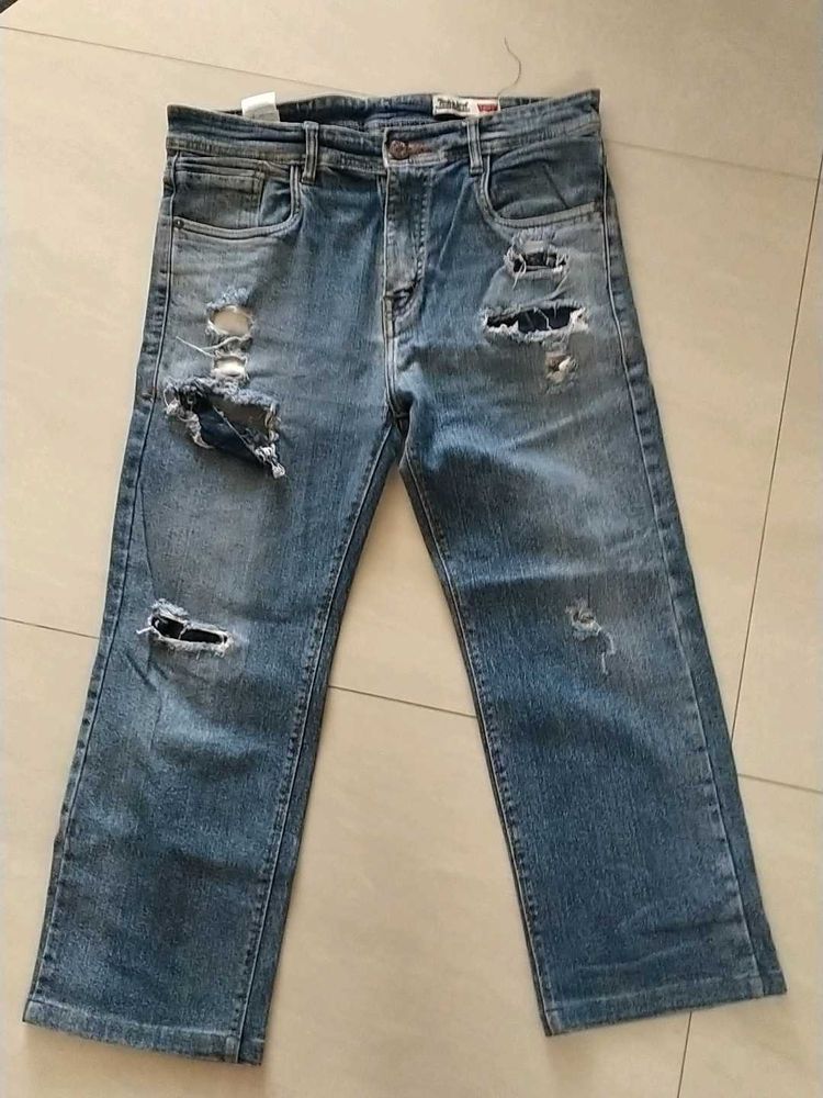Distressed Blue Denim Jeans
