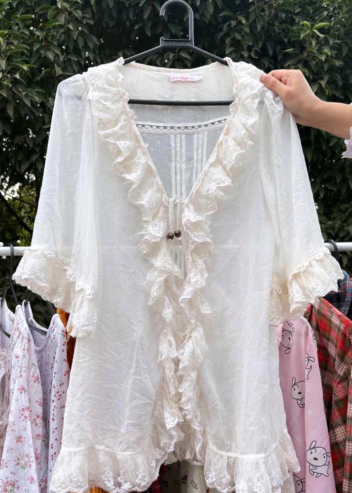 Liz Lisa sheer ruffled lace blouse/cardigan.